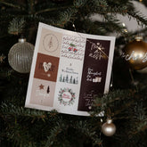 Genussfux Weihnachts-Stickerbogen mit neun runden Motiven (u. a. Frohe Weihnachten, Merry Christmas, Von Herzen Danke, Make a Wish) an einem Tannenbaumzweig